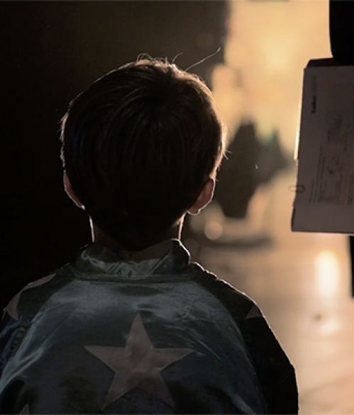 Boy backstage in the wings